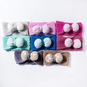 Set of 8 colorful knitted baby headbands with large floral embroidered lace bows