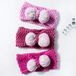 Three-piece set of knitted baby headbands with embroidered floral bow tie accents