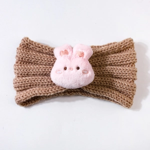 Detailed view of brown chunky knit baby headband featuring a cute pink plush bunny accent