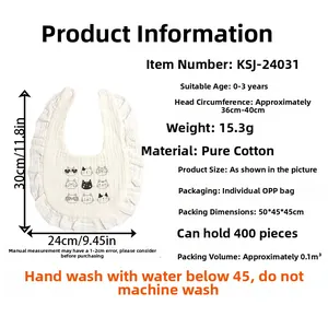 Detailed view of white cotton baby bib with ruffle trim and cute nine-grid cat print details