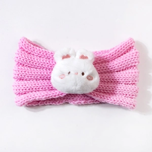 Detailed close-up of a pink knitted baby headband with a white plush rabbit decoration