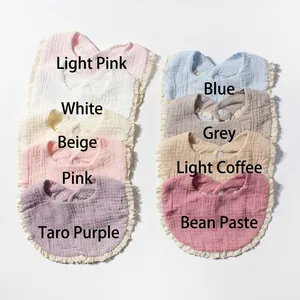 Detailed grid of 9 multi-color cotton baby bibs featuring soft gauze texture and lace trim