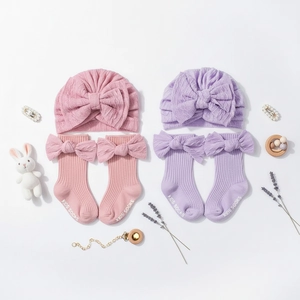 Detailed set of pink and purple baby jacquard turban hats and bow knee high socks
