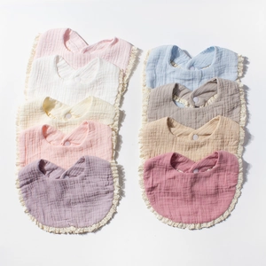 9-piece set of cotton gauze baby bibs with lace trim in assorted Morandi colors