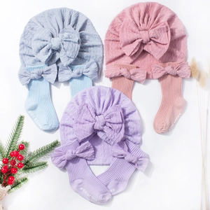 Baby jacquard knitted hat and socks set with large bows in blue, pink and purple