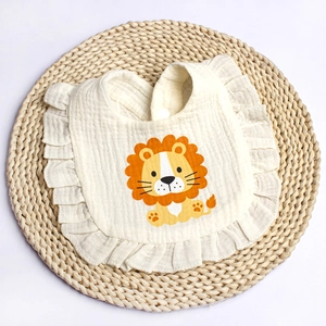 Cotton gauze baby bib with ruffle edge and cute cartoon lion print on woven mat
