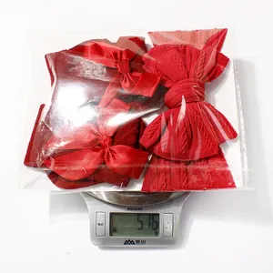 Detail view of red baby headband and socks set weighing 51.6g for newborn festive outfits