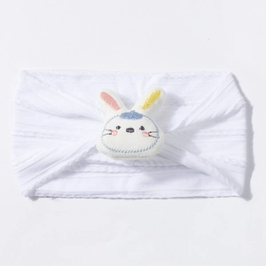 Close-up of white soft knit baby headband with 3D plush bunny and embroidery