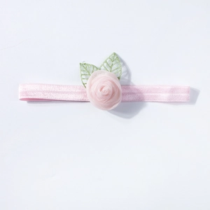 Pink elastic baby headband with mesh 3D rose and green leaves on white background