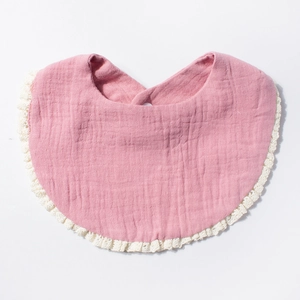 Absorbent soft cotton gauze baby bib in dusty pink with elegant white crochet lace trim