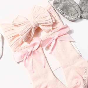 Pink knit baby headwrap and long socks set with double-layered bows and non-slip soles