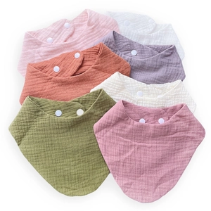 Organic cotton muslin baby bibs set in seven various colors with snap closures