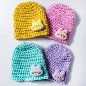 Knitted winter baby hats with cute plush bunny decorations in vibrant macaron colors