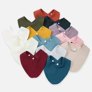Soft cotton muslin baby bibs in various Morandi colors with secure snap buttons