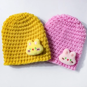 Infant warm knitted beanie set featuring cute 3D bunny patches in yellow and pink colors