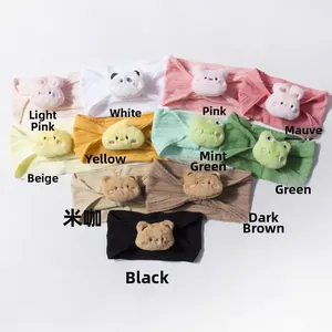 Flat lay of baby jacquard headbands with cute 3D plush animals in multiple colors