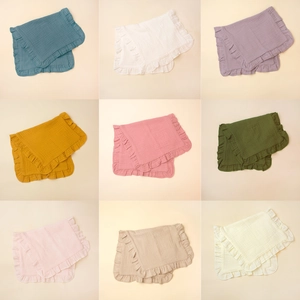 Muslin cotton baby burp cloths with ruffled edges in nine different pastel colors