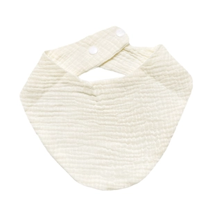 Detail view of organic white cotton gauze baby bib with double snap buttons for adjustment
