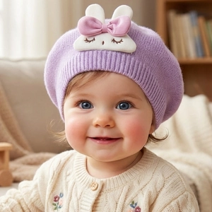 Detail of baby purple knitted beret with cute 3D bunny accessory and soft ribbed edge