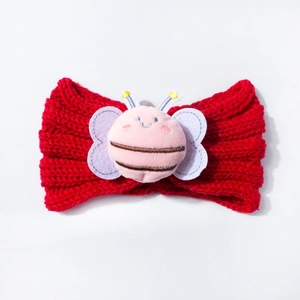 Detailed knit texture of red baby headband with a cute pink plush bee ornament