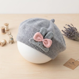 Close-up of baby rabbit beret made of 100% fine cotton with embroidered bunny design