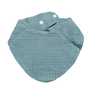 Blue soft cotton muslin baby bandana bib with adjustable snap buttons on white background