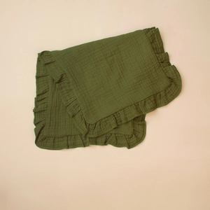 Detail of soft dark green muslin baby burp cloth with elegant ruffled edge texture