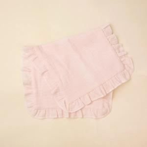 Pink cotton gauze baby burp cloth with ruffled edges and soft textured muslin fabric