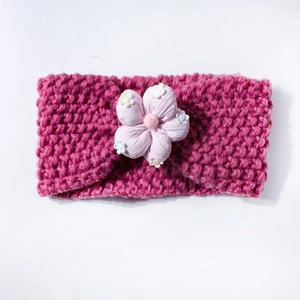 Knitted dark pink baby headband with a soft floral fabric flower for newborns