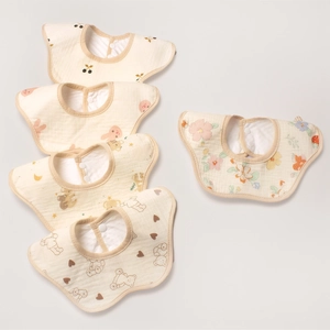 Close-up of 360-degree petal shaped cotton baby bibs with cute cartoon animal prints