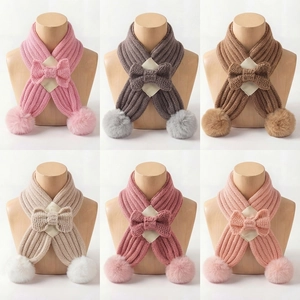 Knitted kids winter scarf with bow and pom poms available in six various colors