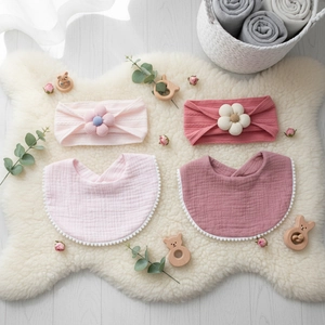 Infant floral headband and pom-pom bib set in soft pink cotton muslin fabric