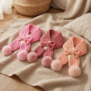 Kids knitted bow scarf with pom poms in pink shades, warm winter neck warmer for babies