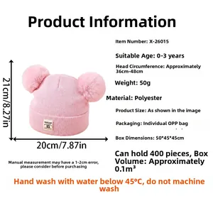 Pink knit baby beanie with double pom-poms and size chart for 0 to 3 years infants