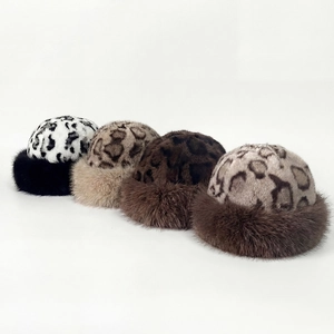 Detail of four leopard print plush hats for kids in various winter-ready faux fur colors