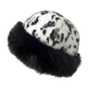 Close-up detail showing the thick faux fur texture and black plush brim of the winter hat