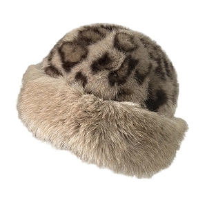 Detailed close-up of leopard print faux fur plush hat with soft brown trim for winter
