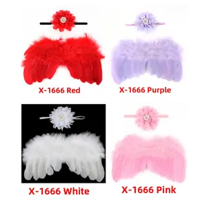 Detail of infant feather angel wings and floral headbands in red, purple, white, and pink