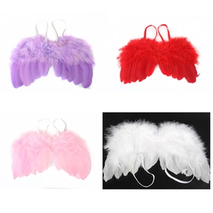 Detailed view of handmade decorative feather wings for newborn and infant photography props