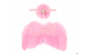 Detailed view of pink feather baby angel wings and matching chiffon flower headband