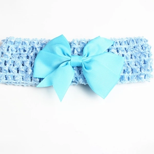 Detail view of baby light blue elastic headband with wide ribbed ribbon bow