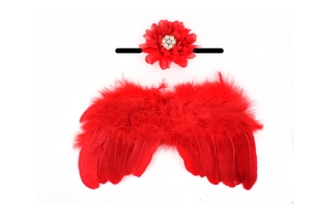 Detailed view of red feather wings and pearl flower headband for infant photography