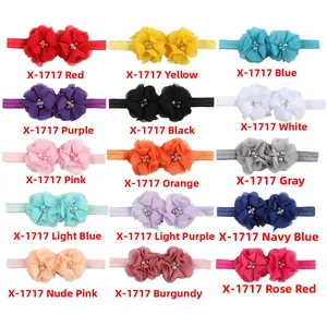 Matrice montrant 15 couleurs de bandeaux bébé avec fleurs en mousseline et perles