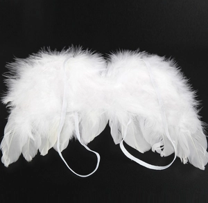 Detail of white angel feather wings with elastic straps for newborn photography props