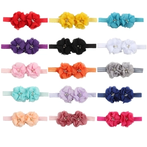 Lot de 15 bandeaux bébé colorés avec fleurs en mousseline, perles et paillettes sur blanc