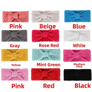 Detail showing 12 colors of knitted winter baby headbands with crochet bow design