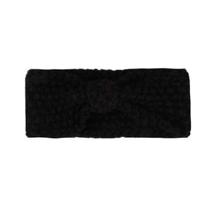 Close-up of black knitted baby headband featuring a bow-shaped thick cable knit design