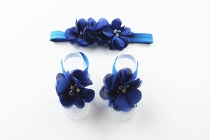 Three-piece baby set with navy blue chiffon flower headband and matching barefoot sandals