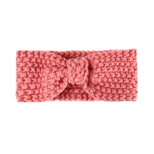Detailed view of pink knitted baby headband with a decorative bow knot and coarse yarn texture