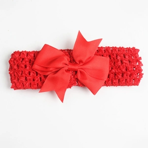 Detail of red oversized grosgrain bow on elastic wide crochet headband for baby girls